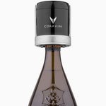 Coravin wine preservation tool on a Veuve Clicquot champagne bottle, showcasing brand logo and bottle design.