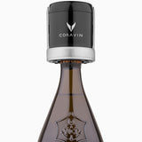 Coravin wine preservation tool on a Veuve Clicquot champagne bottle, showcasing brand logo and bottle design.