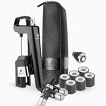 Coravin wine preservation system with black opener, carrying case, gas capsules, and pour spout.