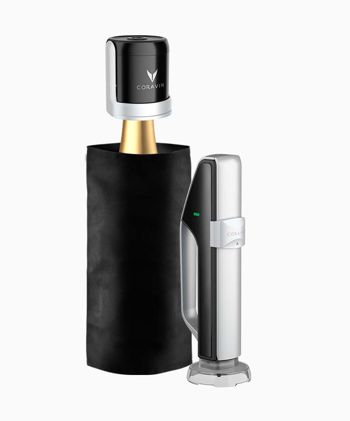 Coravin wine preservation system with black protective sleeve, needle, and silver handle for accessing wine without cork removal.