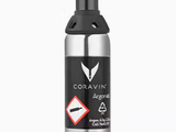 Coravin Argon gas canister, featuring a safety symbol and text indicating chemical composition and recycling instructions.
