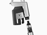 Coravin wine preservation system with a sleek silver and black design, featuring the logo and a needle for pouring.
