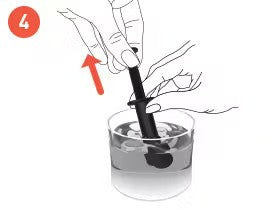 A hand holding a black stirring stick, immersed in a glass of water with ice, with an arrow indicating an upward motion.