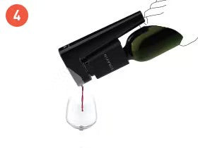 Wine being poured from a black aerator into a wine glass, showcasing a smooth pour of red wine.