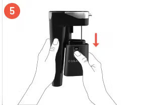 Step 5: Hands holding a black soda maker, with a battery pack being inserted into the device, indicated by a downward arrow.