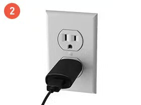 Power adapter plugged into a wall outlet with a visible two-pronged socket. Red circle labeled "2" in the corner.