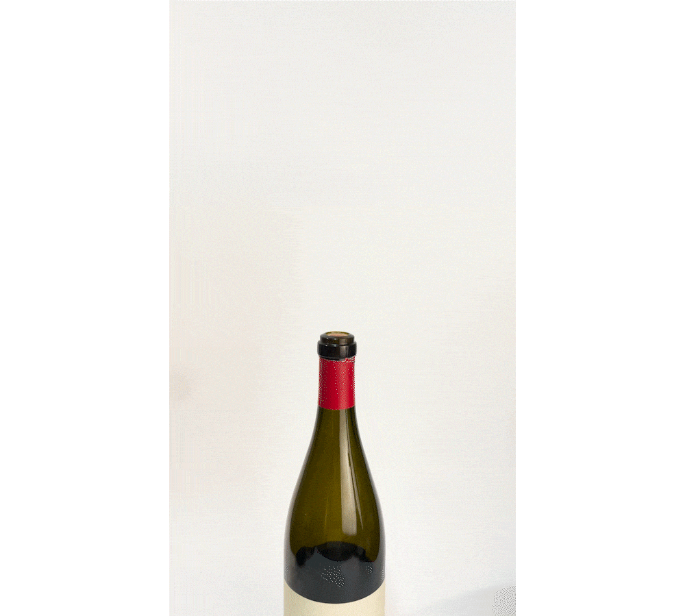 A green wine bottle with a red cap sits against a white background, showcasing its distinctive design and colors.