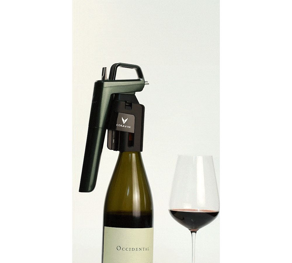 Coravin wine opener on a bottle labeled "Occidental," next to a filled wine glass.